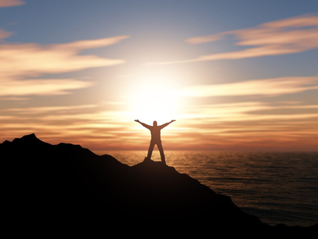 3D render of a silhouette of a man with arms raised against a sunset ocean landscape