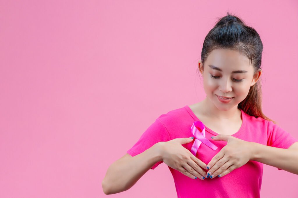 breast-cancer-awareness-woman-pink-t-shirt-with-satin-pink-ribbon-her-chest-supporting-symbolbreast-cancer-awareness.